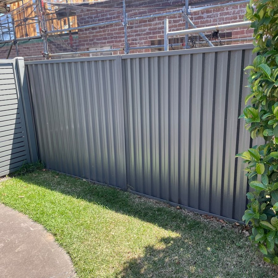 The same grey Colorbond fence after new panels went in